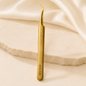 Essira 32B Elite gold volume boot tweezer on cream luxury background