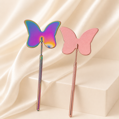 Essira iridescent and pink butterfly lash mirrors on an ivory luxury background