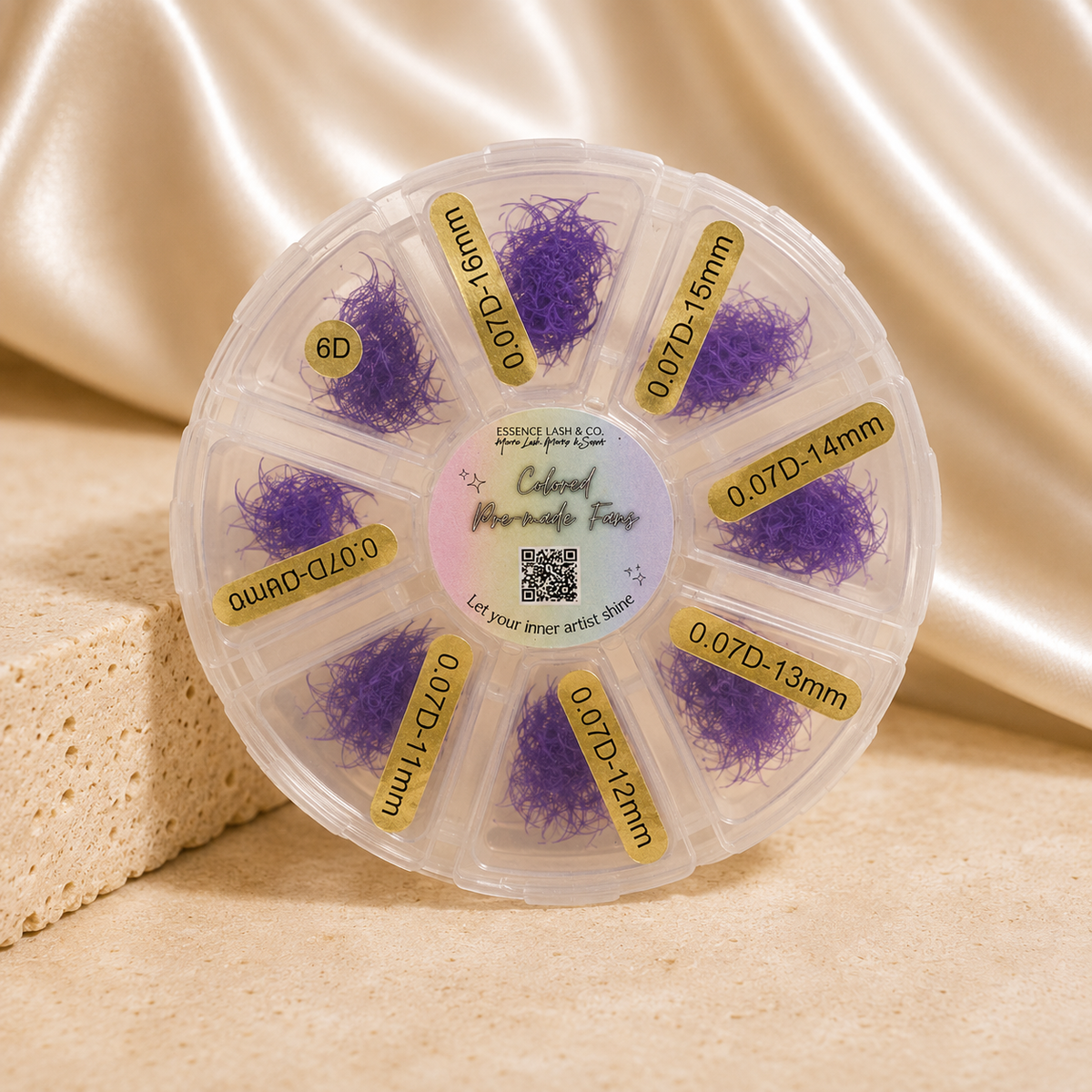 Purple Colored Premade Lash Fans on cream satin and travertine background