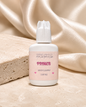 Essira Lash Primer on cream satin and travertine background