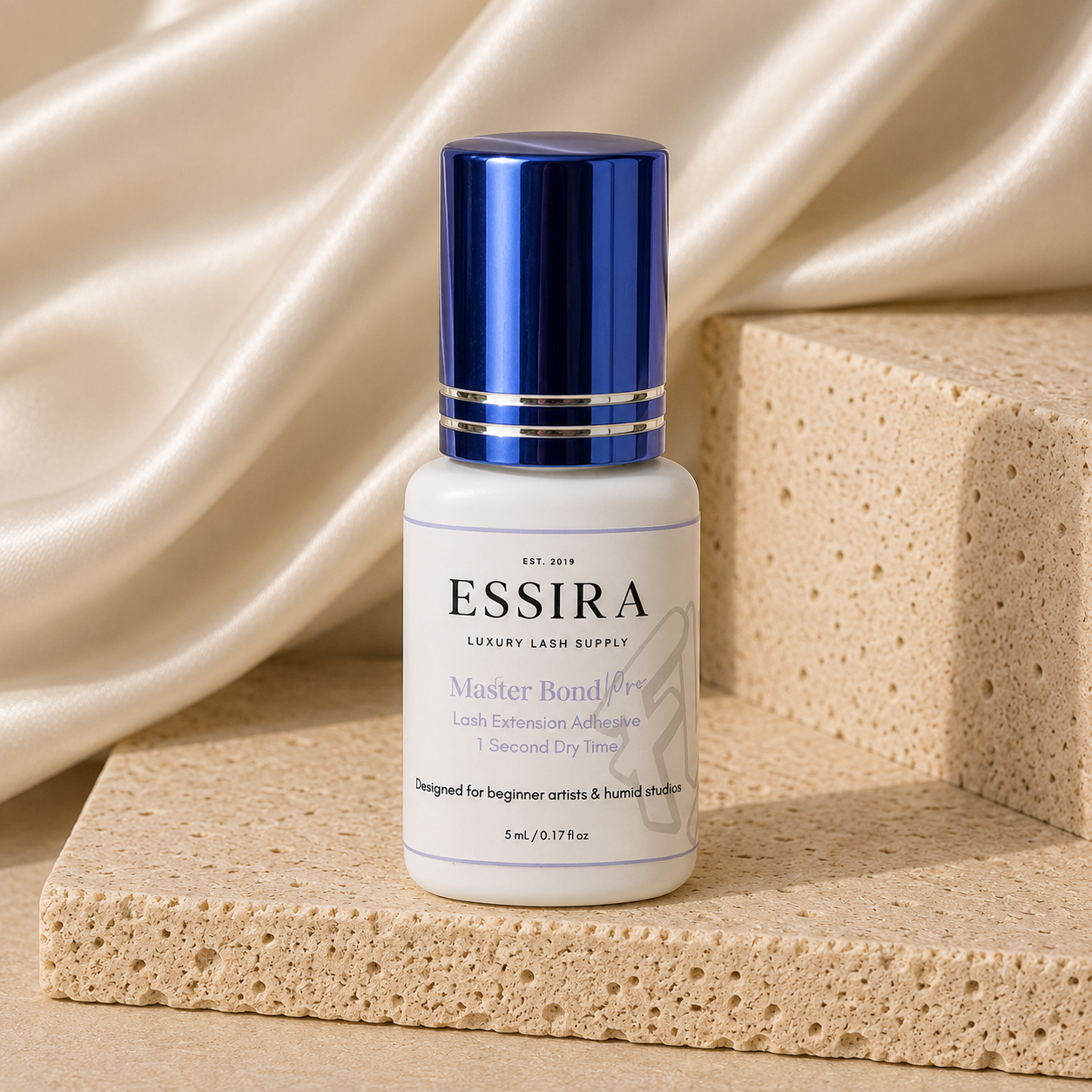 Essira Master Bond Pro adhesive on cream satin and travertine background