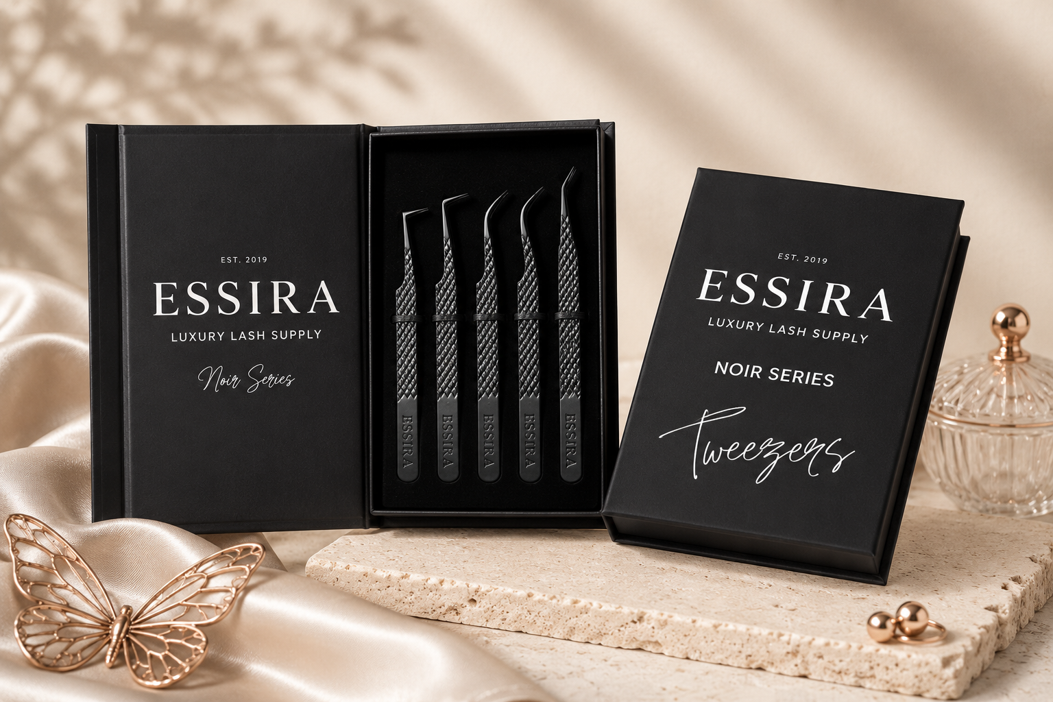 Essira Noir Series 5 Piece Tweezer Set in original black packaging on a luxury cream background