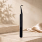 Essira Noir F8 90 degree volume tweezer on cream luxury background