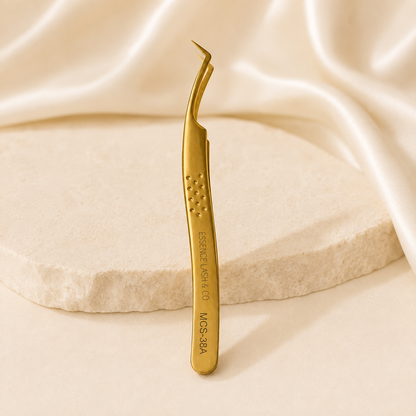 Essira Pro Grip 38A gold tweezer on cream luxury background