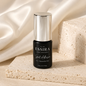 Essira Speed Adhesive on cream satin and travertine background