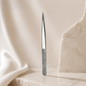 Essira ST-11 silver straight tweezer on a luxury cream background